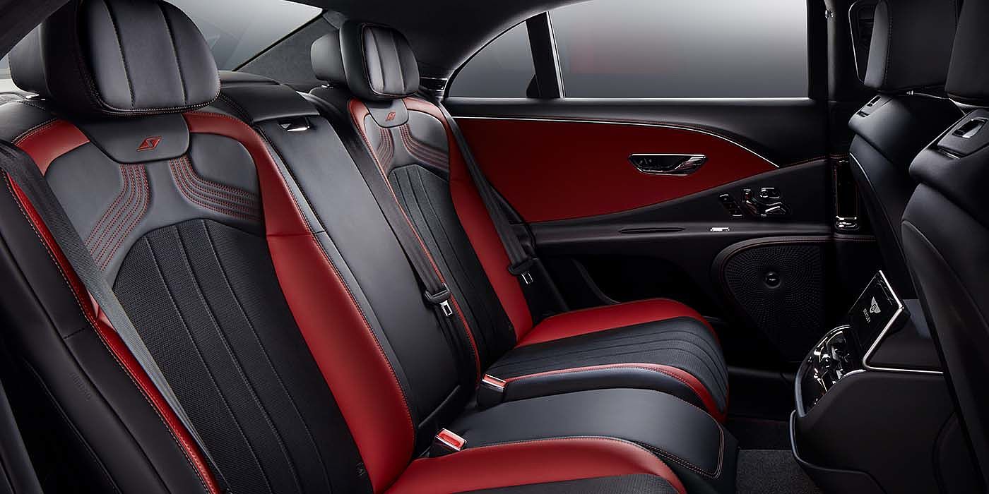 Bentley Leicester Bentley Flying Spur S sedan rear interior in Beluga black and Hotspur red hide with S stitching