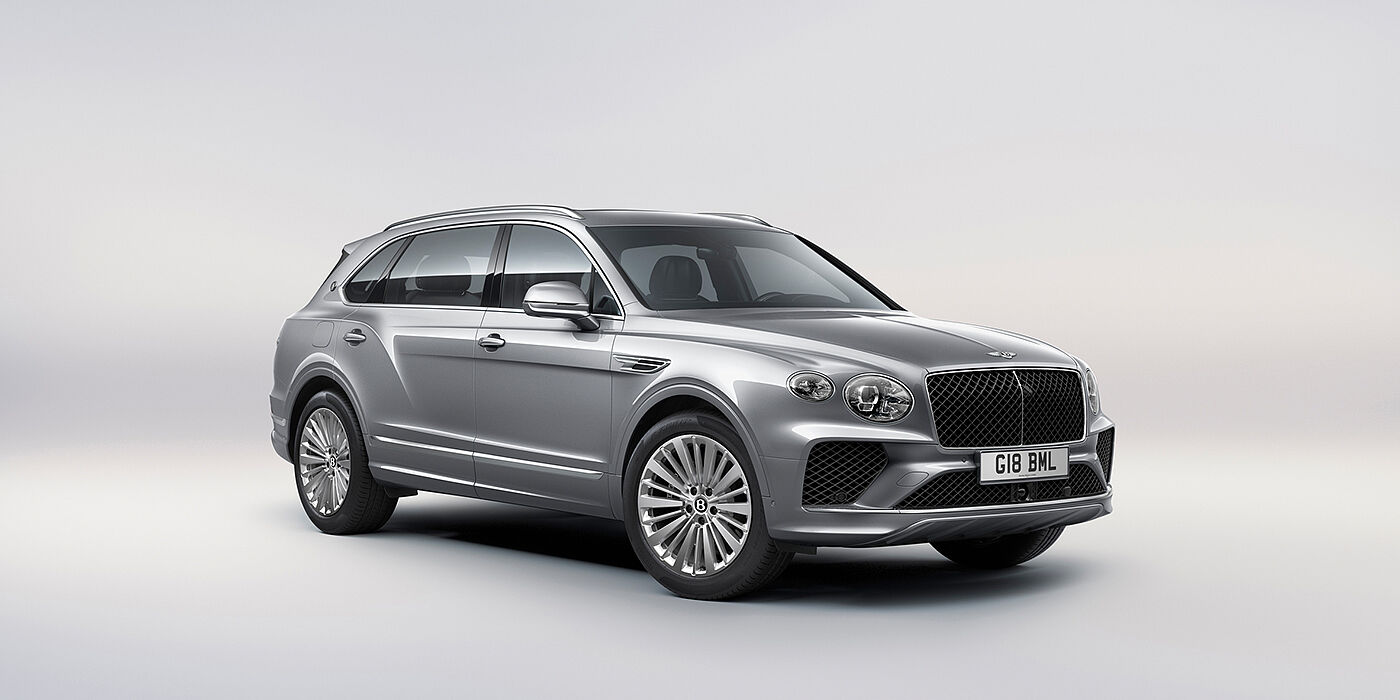 Bentley Leicester Bentley Bentayga Extended Wheelbase luxury SUV front three quarter view in Moonbeam paint with 21 inch five spoke painted wheels