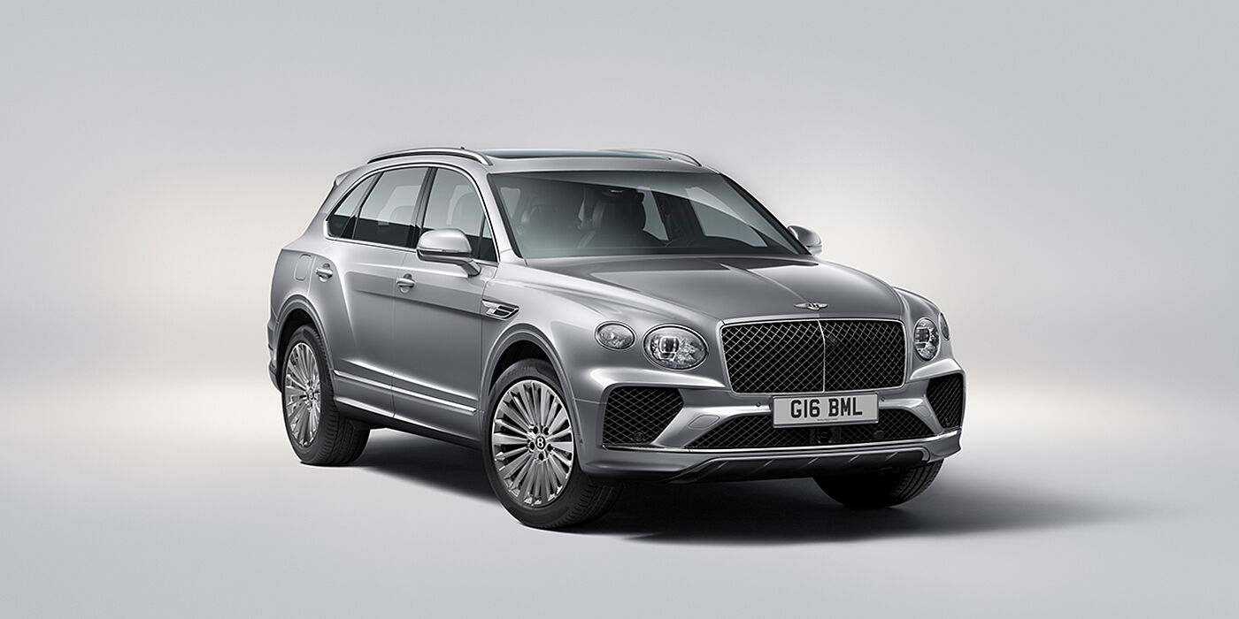 Bentley Leicester Bentley Bentayga luxury SUV front three quarter view in Moonbeam paint with matrix grille and 21″ 5 spoke painted wheels