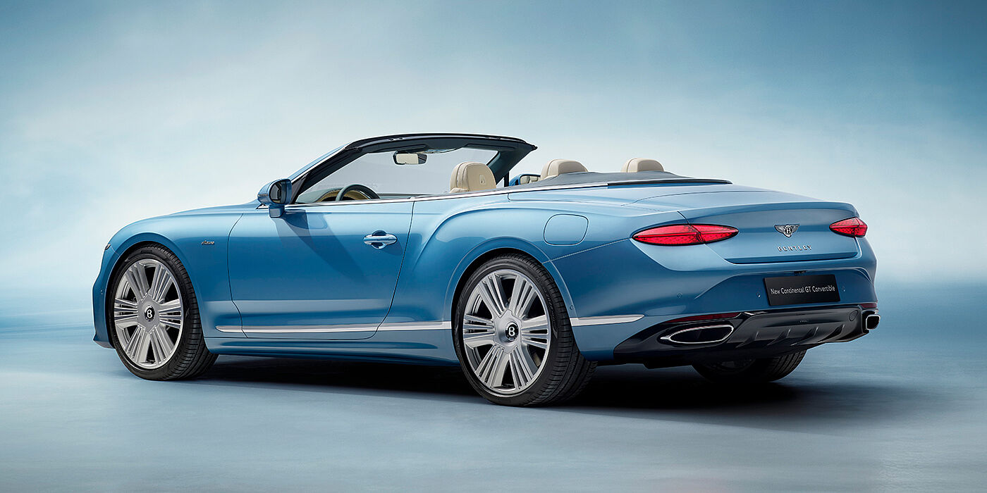 Bentley Leicester New Bentley Continental GTC Azure convertible rear view in Light Windsor blue paint with 22 inch ten spoke wheels and chrome exterior details