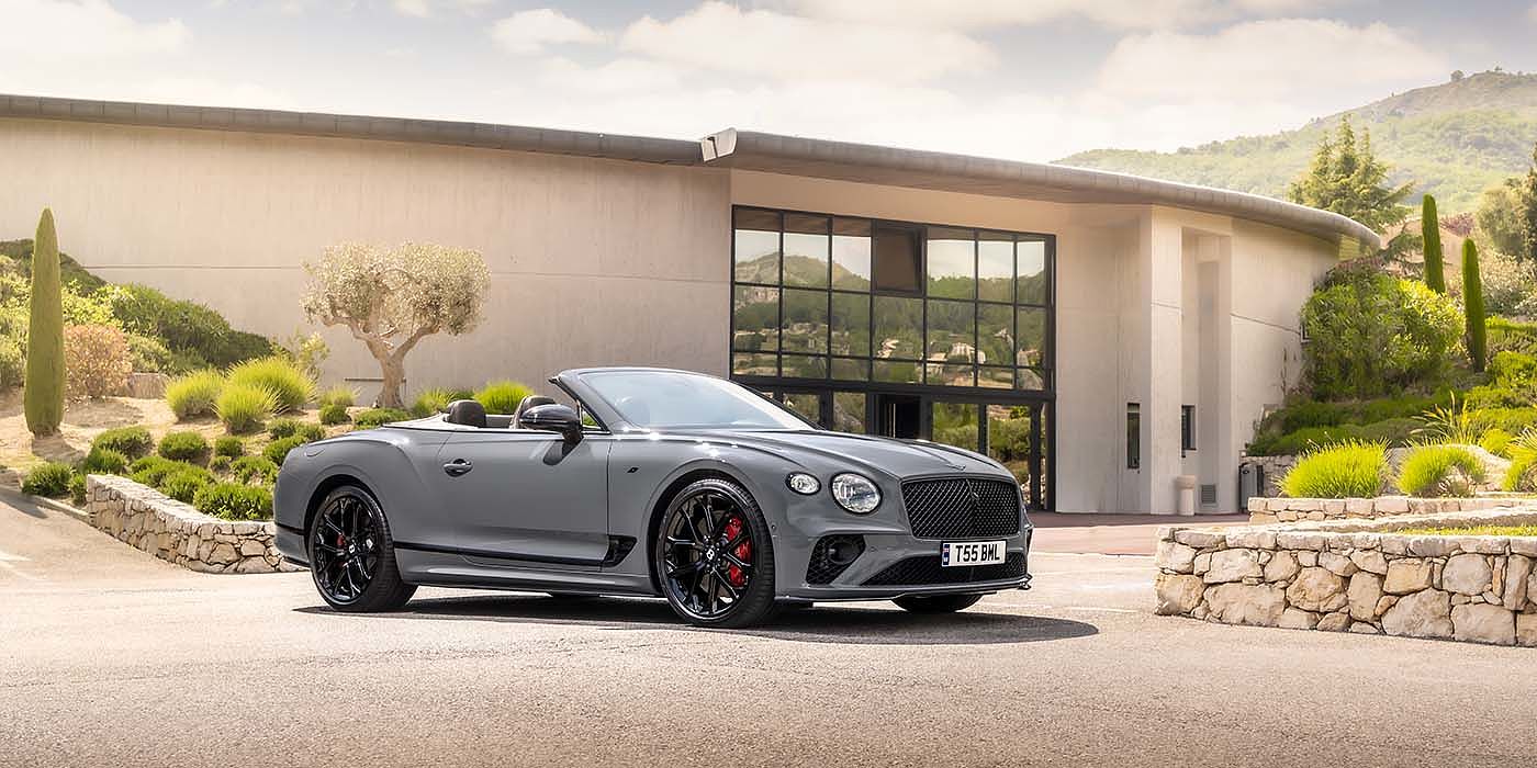 Bentley Leicester Bentley Continental GTC S convertible in Cambrian Grey paint front 34 static near house