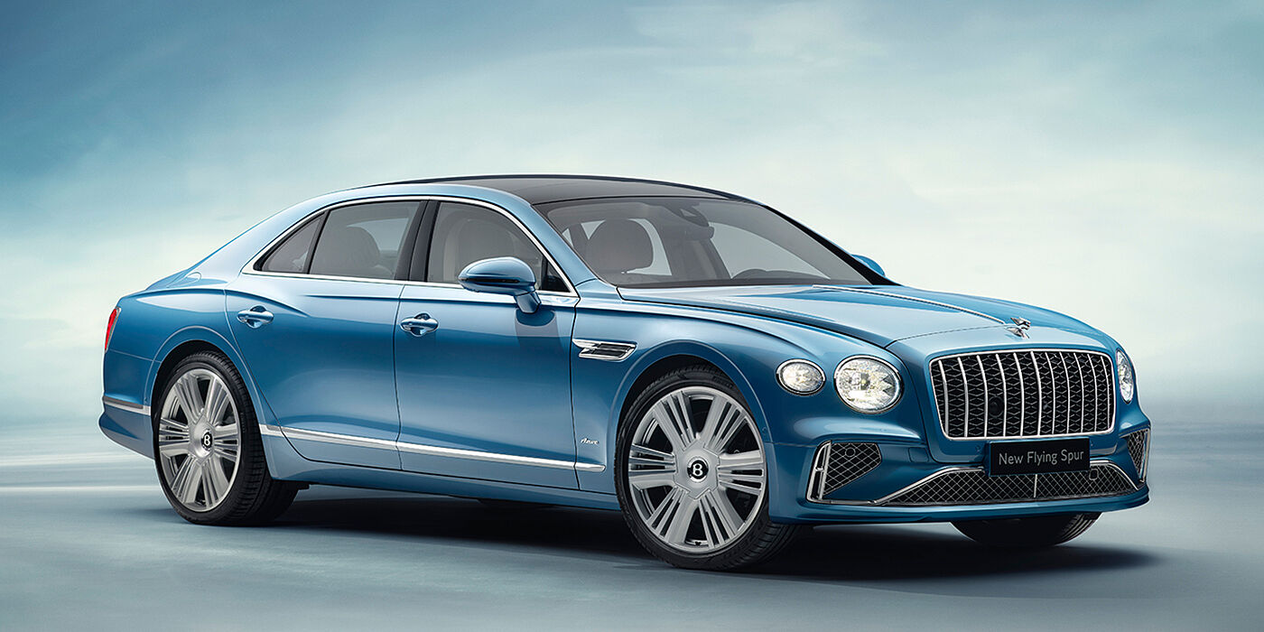 Bentley Leicester New Bentley Flying Spur Azure sedan front view in Light windsor blue by Mulliner paint with 22 inch Azure wheels and chrome exterior details