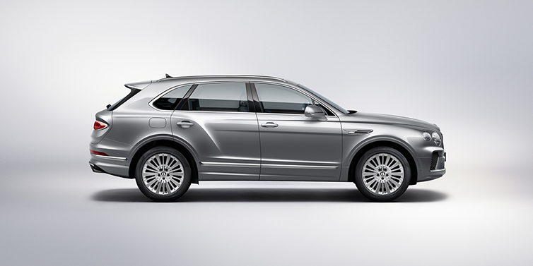Bentley Leicester Bentley Bentayga SUV side profile in Moonbeam silver paint against white background featuring 21 inch 5 spoke wheels
