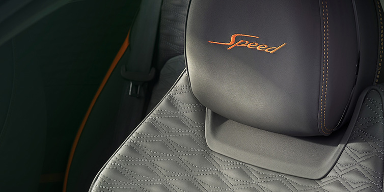 Bentley Leicester Bentley Continental GT Speed coupe seat detail in Gravity Grey hide and Speed emblem in Mandarin by Mulliner coloured embroidery