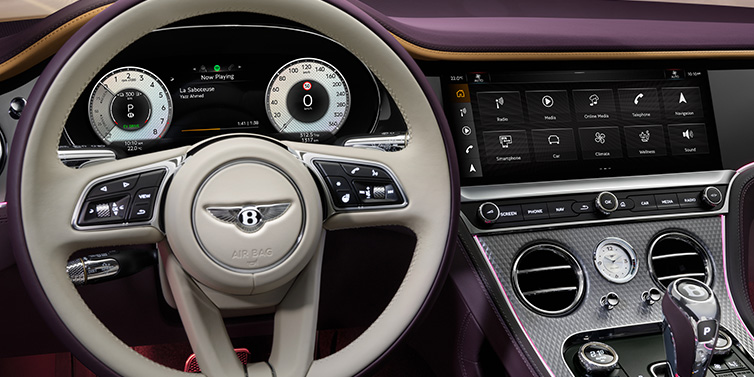 Bentley Leicester Bentley Continental GTC Mulliner convertible steering wheel and drivers screens surrounded by Damson purple and Linen hides